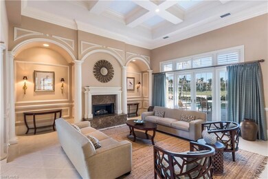Living room with gas fireplace, pillared cut outs 