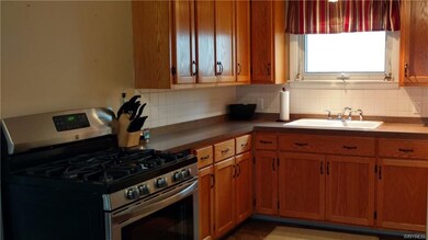 This bright and open kitchen includes a Kenmore st