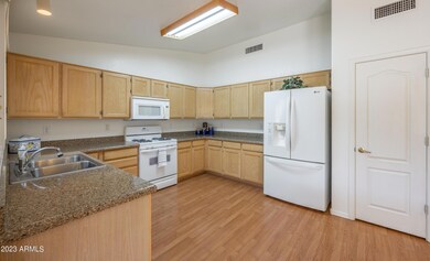 Kitchen features Silestone countertops, gas range, french door refrigerator with water and ice, built-in micro and pantry.