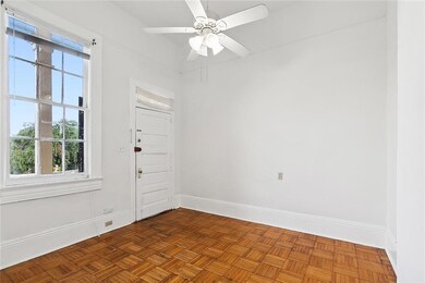 Bedroom has a door to exterior stairs.