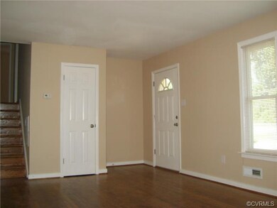 Freshly painted walls and refinished hardwood floo