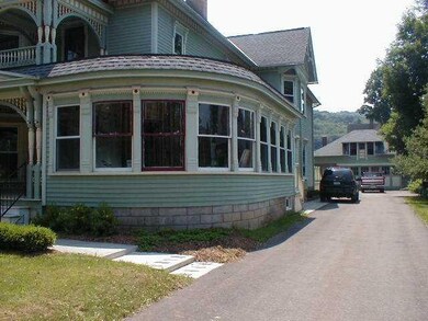 Exterior Front Note the enclosed side porch with c