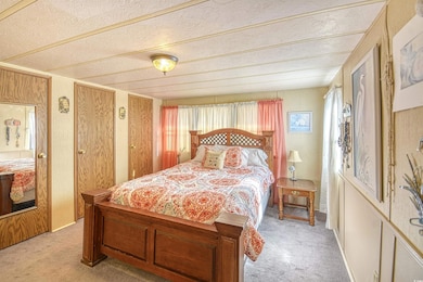 Bedroom with light colored carpet