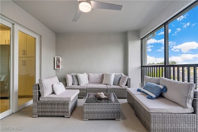 Sunroom / solarium featuring ceiling fan and a wea