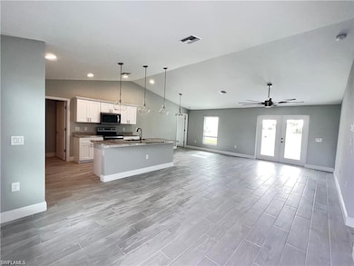 Kitchen with appliances with stainless steel finis