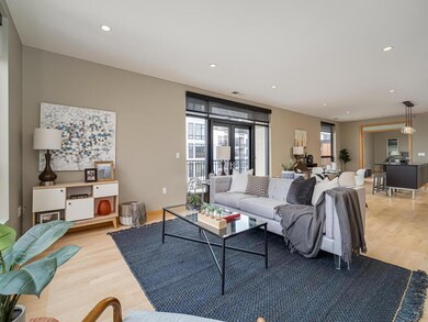Living room open to informal dining, balcony and k