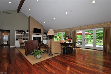 Vaulted ceilings and French doors lead out to priv