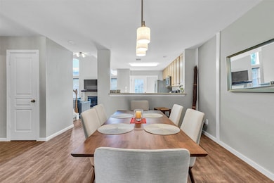 This photo showcases a modern dining area with a w