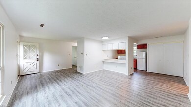 Living room featuring light hardwood floors and a 