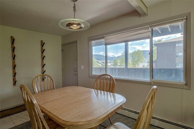 Tiled dining space with baseboard heating