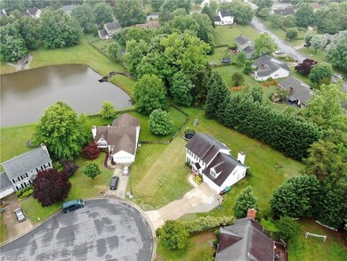 Drone view shows pond that is accessible to all neighborhood! Nice spacing between homes. Backyard is private w/evergreen buffer.