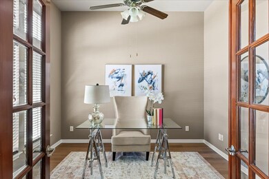 Office space with wood finished floors, a ceiling