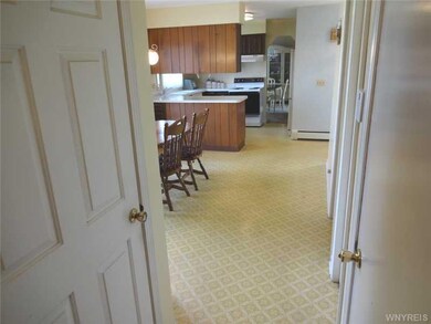 Kitchen view from hallway (basement door on left, 