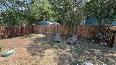 View of fenced backyard