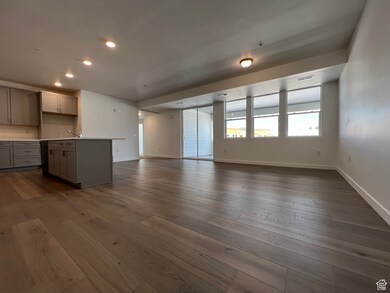 Unfurnished living room with dark hardwood / wood-style flooring