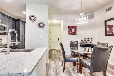 Dining area with easy access to galley kitchen. Ad