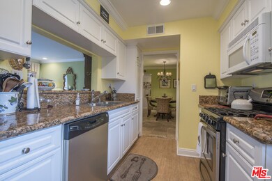 Bright, spacious, elegant kitchen opens to living 