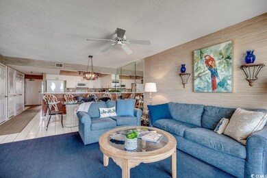 Living room with a textured ceiling, ceiling fan, 