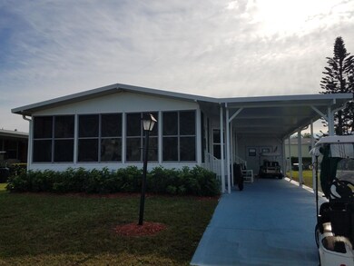 Carport with Utility Shed