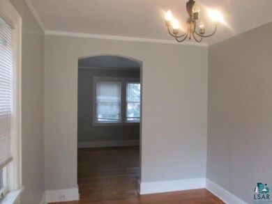 Spare room with dark hardwood / wood-style floorin