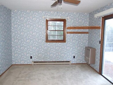 Bedroom with sliding glass door to deck