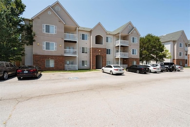 View of property with uncovered parking