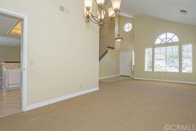 Dining Room, Living Room, looking onto Entryway.