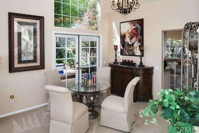 Formal dining has views to the side yard and spa .
