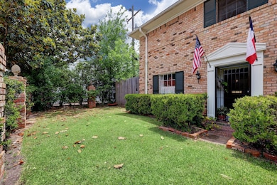 Left unit: Fenced front yard space shows private entry and grassy space.