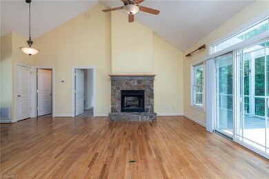 Great room with vaulted ceilings and stone fireplace