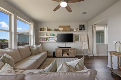 Living room with dark wood-style flooring, a ceil