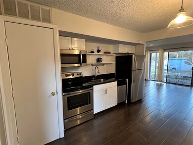 Another view of the kitchen shows the stainless sl