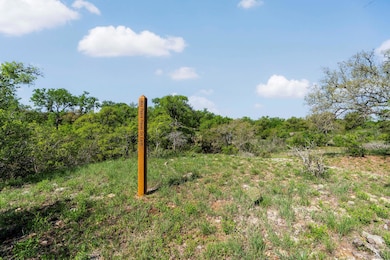 View of landscape featuring a view of trees