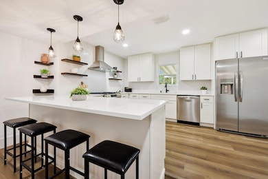 Kitchen with a sink, stainless steel appliances, 