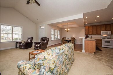 Great Room with vaulted ceiling, gas fireplace and