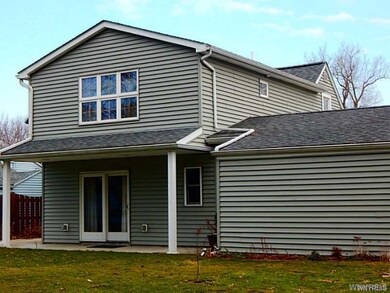 Exterior Back. Sliding doors to covered patio make