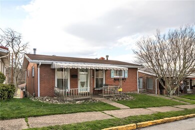 Sidewalk lined street. Covered front porch entry.
