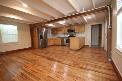 Kitchen with stainless steel appliances, light wo