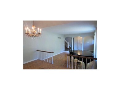 Formal sunken living room w/hardwood floors!