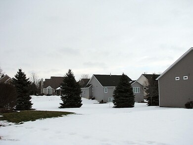 Large pines line back of property