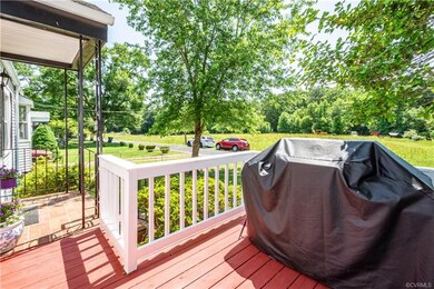 Covered front porch and front deck.  Across the st