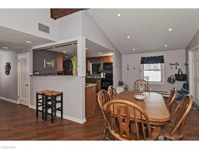Hardwood floors take you from the living room to t