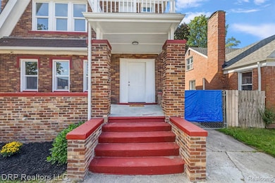 Doorway to property with brick siding