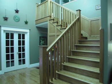 Grand Foyer w/Staircase & French Drs.