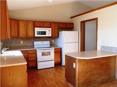 Nice open kitchen with tile back splash.