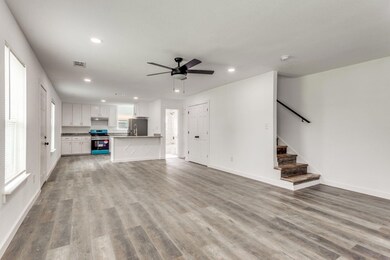 Unfurnished living room with ceiling fan, light wo