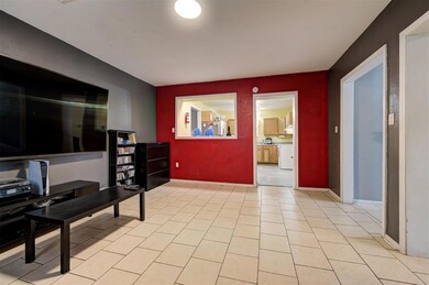 Living area with light tile floors