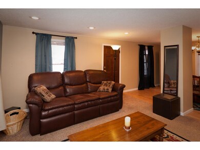 Enter into this charming living room from the fron