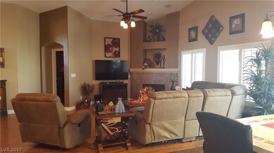 Family Room with Ceiling Fan and shutters