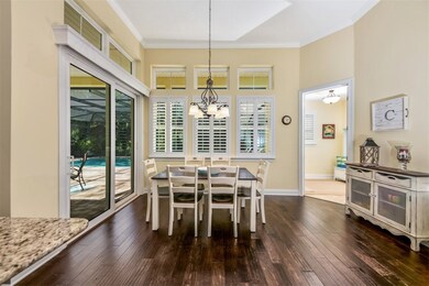 Large breakfast nook overlooks the pool and is bat
